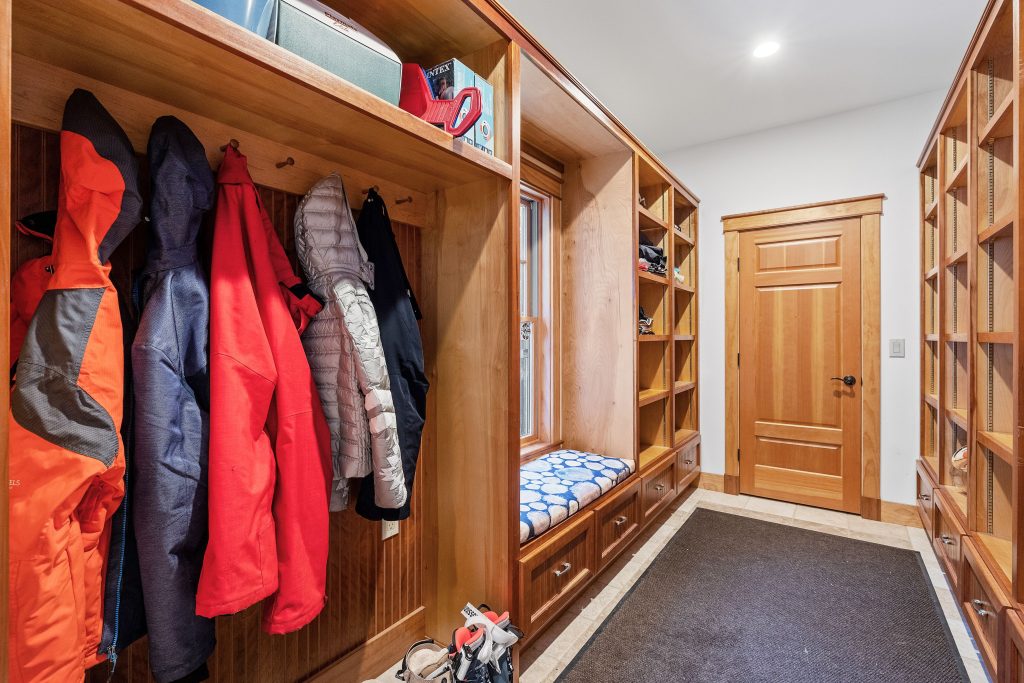 Beautiful contemporary rustic home interior wooden wardrobe design with hanging coats A mudroom with plenty of extra storage and space