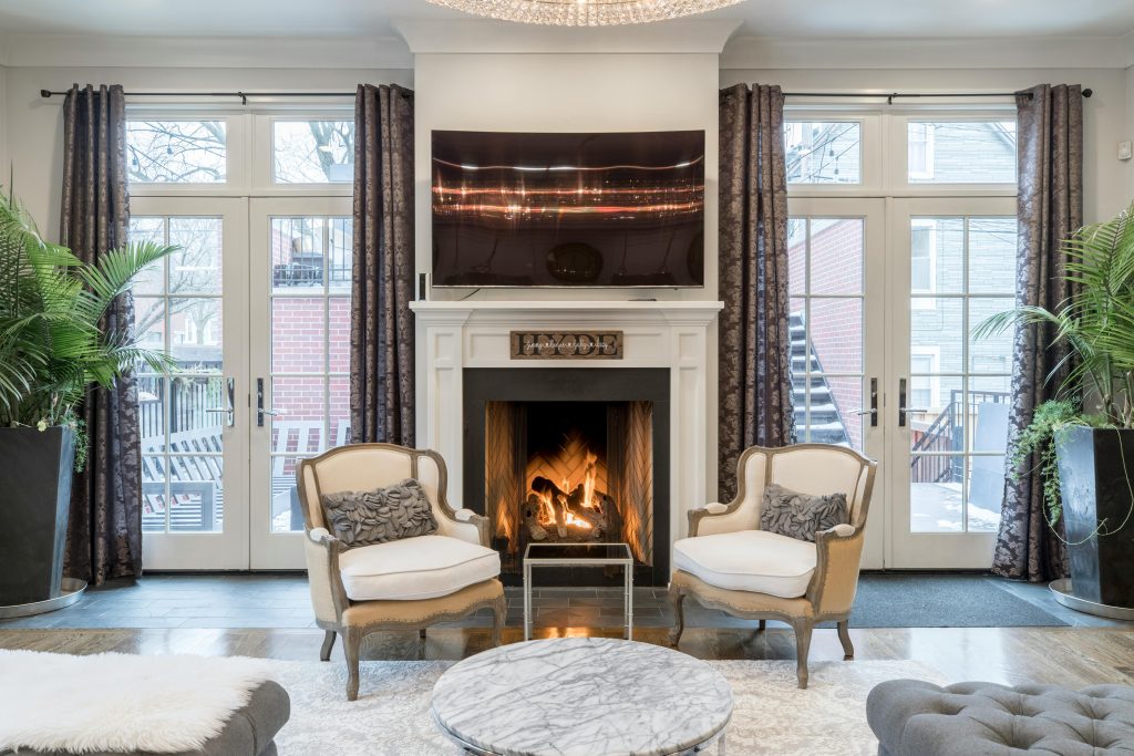 Winter home maintenance checklists in Roanoke, VA. Stylish and contemporary living room featuring a cozy fireplace and elegant furniture.