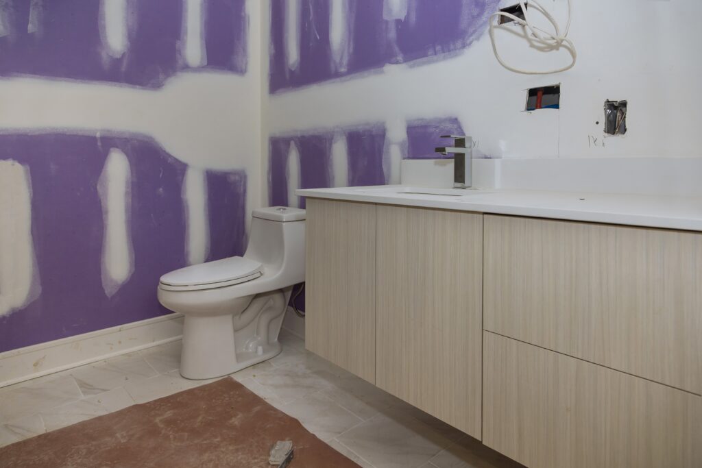bathroom remodel in SWVA An inviting interior view of a bathroom undergoing renovation in Roanoke, VA, showcasing modern design elements and a soothing color palette.

